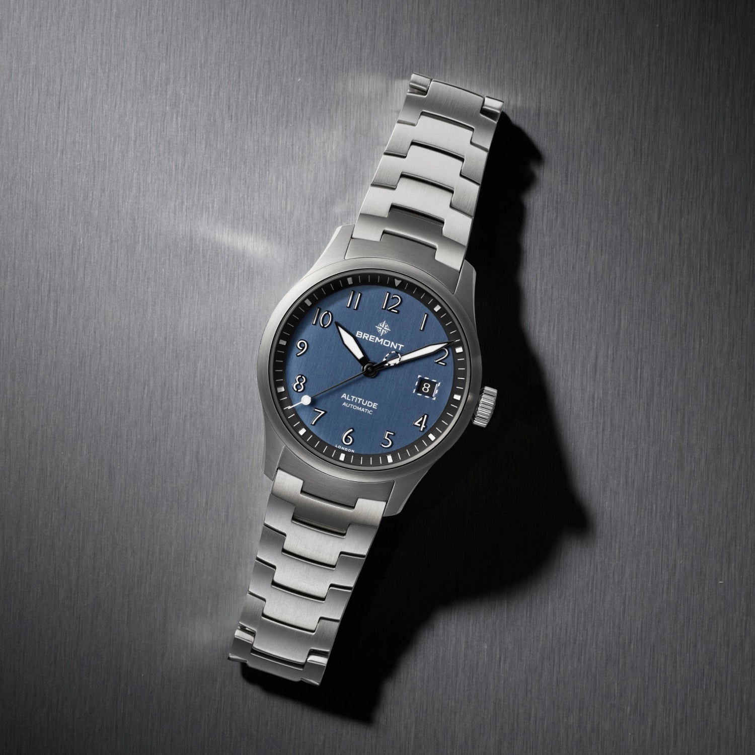 Bremont Silver watch with blue dial on a metallic surface